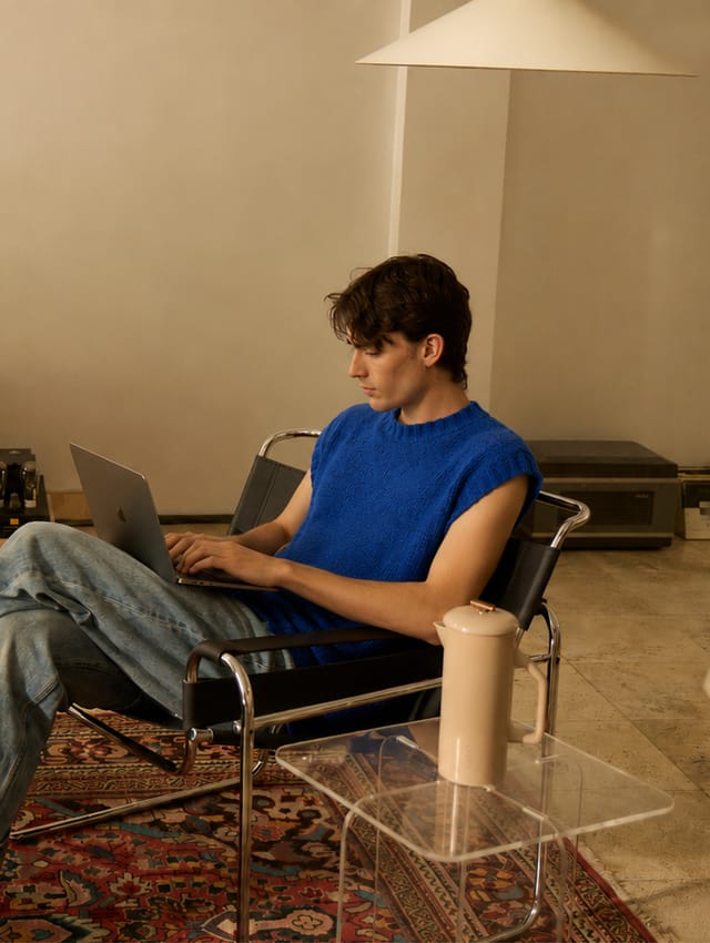 Business owner working on a laptop at home