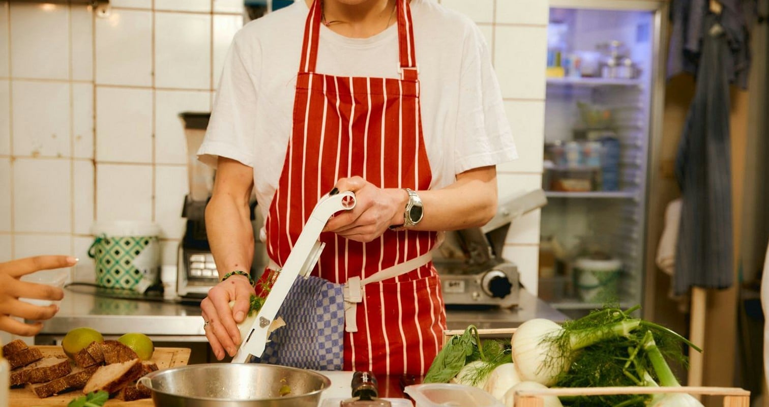 Restaurant owner preparing food in a commercial kitchen